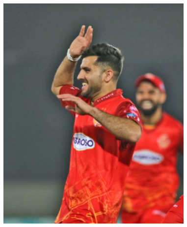 Fazalhaq Farooqi celebrating his wicket